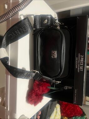 NYC Black Crossbody Bag with Red Pom Charm